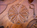 Detailed hand carved flower on traditional hungarian oak wood gate pylon . Royalty Free Stock Photo