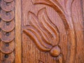 Detailed hand carved flower on traditional hungarian oak wood gate pylon . Royalty Free Stock Photo