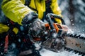 Close-up of a modern chainsaw being operated in a wintery forest setting Royalty Free Stock Photo