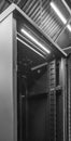 Detailed image of a Computer and Network server cabinet showing the front meshed door open.