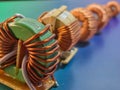 A detailed image of electronic inductors with copper coil windings, in a close-up view. Royalty Free Stock Photo