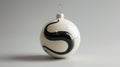 Detailed image of a minimalist white Christmas ornament with a modern, abstract snake design in black, providing a Royalty Free Stock Photo