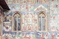 Detailed image of painted wall and windows of Sucevita Monaster