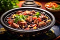 Detailed image of a traditional feijoada, a rich blend of black beans and pork, in a rustic pot.