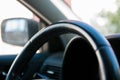 Detailed interior image of leather steering wheel