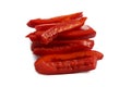 Detailed isolated centered close up food shot of a pile of slices of fresh wet sweet red bell pepper on a white background