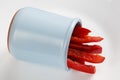 Detailed isolated copy space close up food shot of a pile of slices of fresh wet sweet red bell pepper in a blue round clay