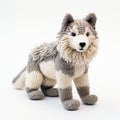 Detailed Knitted Wolf Toy: Hyperrealistic Wildlife Portraits In Gray And Beige