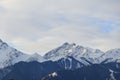 Detailed landscape of snow-covered slopes and peaks of the Trans-Ili Alatau mountains on an autumn, winter morning.