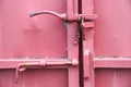 Detailed latch and handle on a red iron door Royalty Free Stock Photo