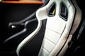 A detailed look at the intricate stitching of a white leather seat. Speed drive concept. AI generation