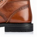 Detailed Macro Shot of Brown Leather Boot Heel and Black Sole Royalty Free Stock Photo