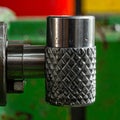 Precision Knurling on a Metal Lathe Component Royalty Free Stock Photo