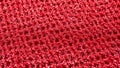 Macro Close-Up of Shiny Red Knit Fabric with Glittering Sparkles, Textured Background Royalty Free Stock Photo