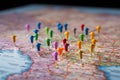 Detailed map with a rainbow of pushpins pointing towards meticulously planned destinations Royalty Free Stock Photo