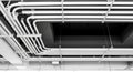 Complex Network of White Electrical Conduits and Pipes on a Ceiling industrial Royalty Free Stock Photo