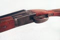 Detailed photo of a double-barrel rifle on a white background