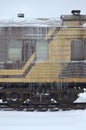Detailed photo of a frozen car passenger train with icicles and ice on its surface. Railway in the cold winter seaso Royalty Free Stock Photo