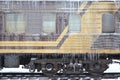 Detailed photo of a frozen car passenger train with icicles and ice on its surface. Railway in the cold winter seaso Royalty Free Stock Photo