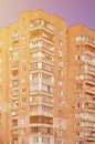 Detailed photo of multi-storey residential building with lots of balconies and windows. Hostels for poor people in Russia and Ukr