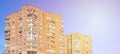 Detailed photo of multi-storey residential building with lots of balconies and windows. Hostels for poor people in Russia and Ukr