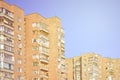 Detailed photo of multi-storey residential building with lots of balconies and windows. Hostels for poor people in Russia and Ukr