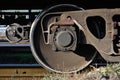 Detailed photo of railway freight car. A fragment of the component parts of the freight car on the railroad in dayligh Royalty Free Stock Photo