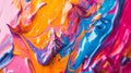 A detailed photograph capturing the fluidity of abstract paint strokes on canvas