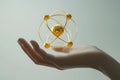 A detailed rendering of a hand holding a golden atomic model symbolizing the connection between science and human understanding Royalty Free Stock Photo