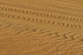 Detailed sand Photograph of Abu Dhabi desert with car tires marks in the sand Royalty Free Stock Photo