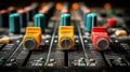 Close-up view of a professional audio mixing console with sliders and knobs Royalty Free Stock Photo