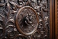 detailed shot of the carved woodwork on a victorian wardrobe door