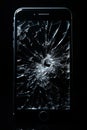 A detailed shot of a cracked smartphone screen