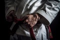 detailed shot of a judokas hand gripping the opponents uniform