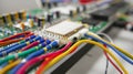A detailed shot of a microcontroller with a colorful display of wires connected to various piezoelectric sensors