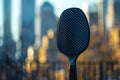 A detailed shot of a pickleball racket against the blurred cityscape at dusk. Generative AI