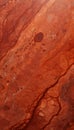 A detailed shot of Red Travertine, displaying warm red tones with natural pits and variations