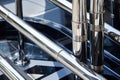 detailed shot of a superyachts chrome handrails and stairs