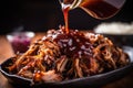 detailed shot of tangy vinegar sauce drizzling on pulled pork