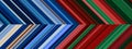 Detailed striped dual geometric pattern composed of big amount of thin green, red and blue stripes