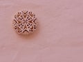 Detailed stucco heraldic emblem of Malta on rough painted wall of pastel colour