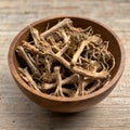 A Detailed Study of Dried Ginger Root in a Wooden Bowl, Featuring Textural Elements and Natural Hues Royalty Free Stock Photo