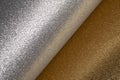 Detailed texture of glittering silver and gold dust surface backdrop