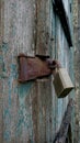 Detailed texture of old wood and rusty padlock