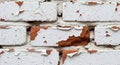 Close up view of weathered white painted bricks revealing aged red brick texture underneath Royalty Free Stock Photo