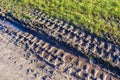 Detailed view on agricultural grounds with tire tracks Royalty Free Stock Photo