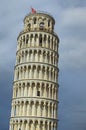 Detailed view of ancient Leaning Tower of Pisa against stormy sky and gloomy clouds. Notable landmark of Pisa Royalty Free Stock Photo