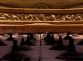 Detailed view from below of the ornaments of the red wooden main door with wrought iron motifs and the cornice with bas-reliefs of Royalty Free Stock Photo