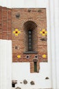 Detailed view of big window with round glasses in a red brick wall with decoration. Church of St. George in Bila Tserkva, Ukraine Royalty Free Stock Photo