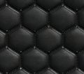 Detailed black leather hexagon pattern with studs and stitching in a repeating design Royalty Free Stock Photo